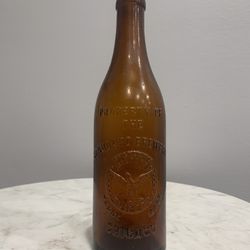 Collection of vintage glass beer bottles from Chicago and Milwaukee