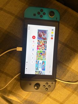 Nintendo Switch with Teal and Gray Joy-Cons