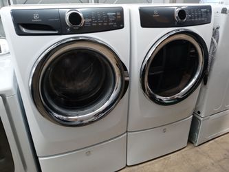 Electrolux front load washer and dryer set on pedestals - Free delivery