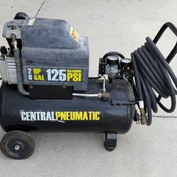 Central pneumatic, 2  HP, 125 PSI, with hose.