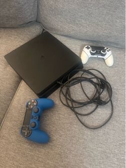 PS4 with cables and controllers