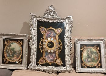 A set of three vintage baroque prints with golden details o