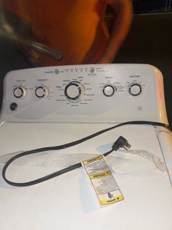 This is a white General Electric top-load washer, specifically a model from the GTW series with "Deep Fill" capabilities.