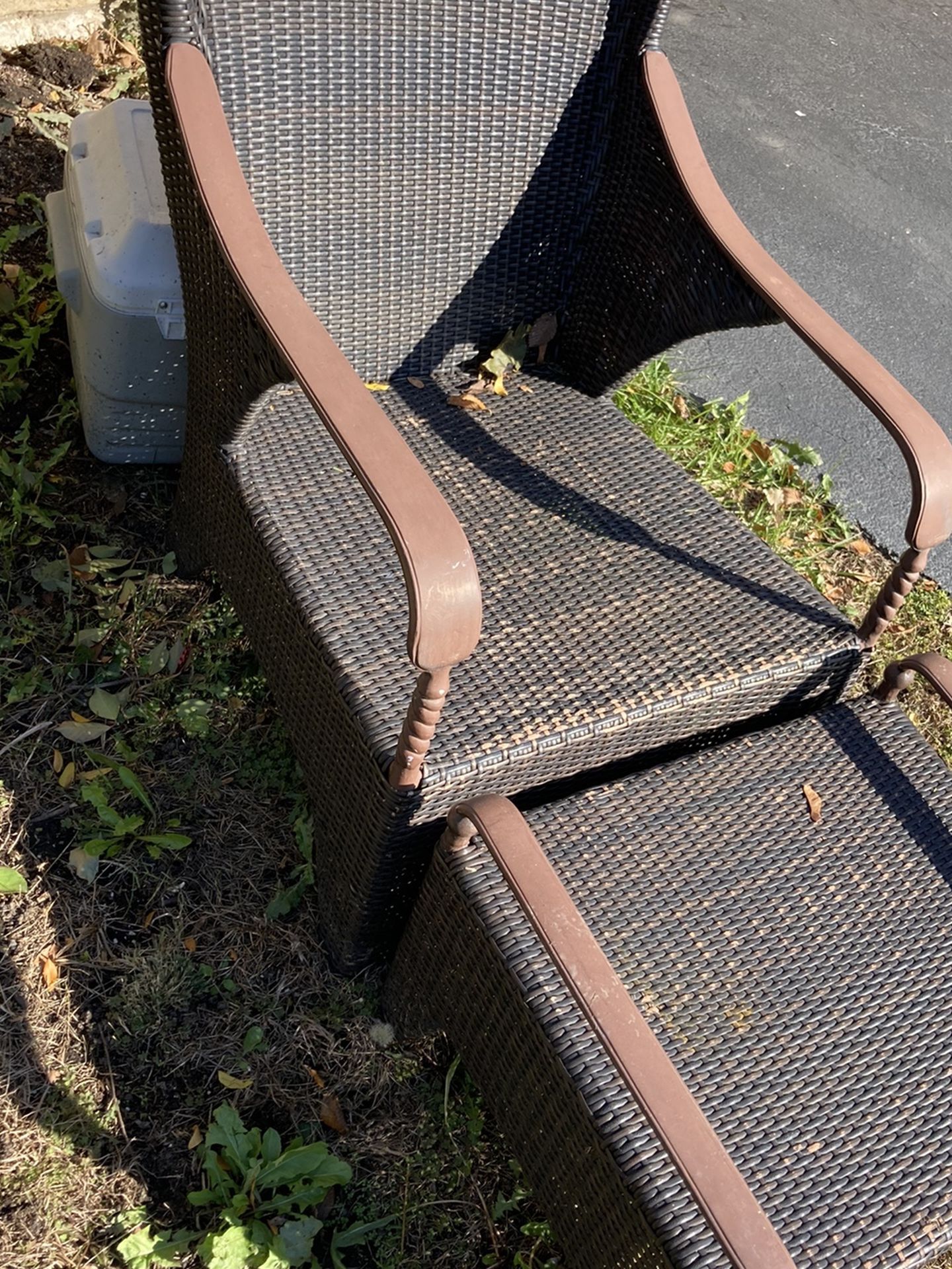 Outdoor wicker chair with ottoman