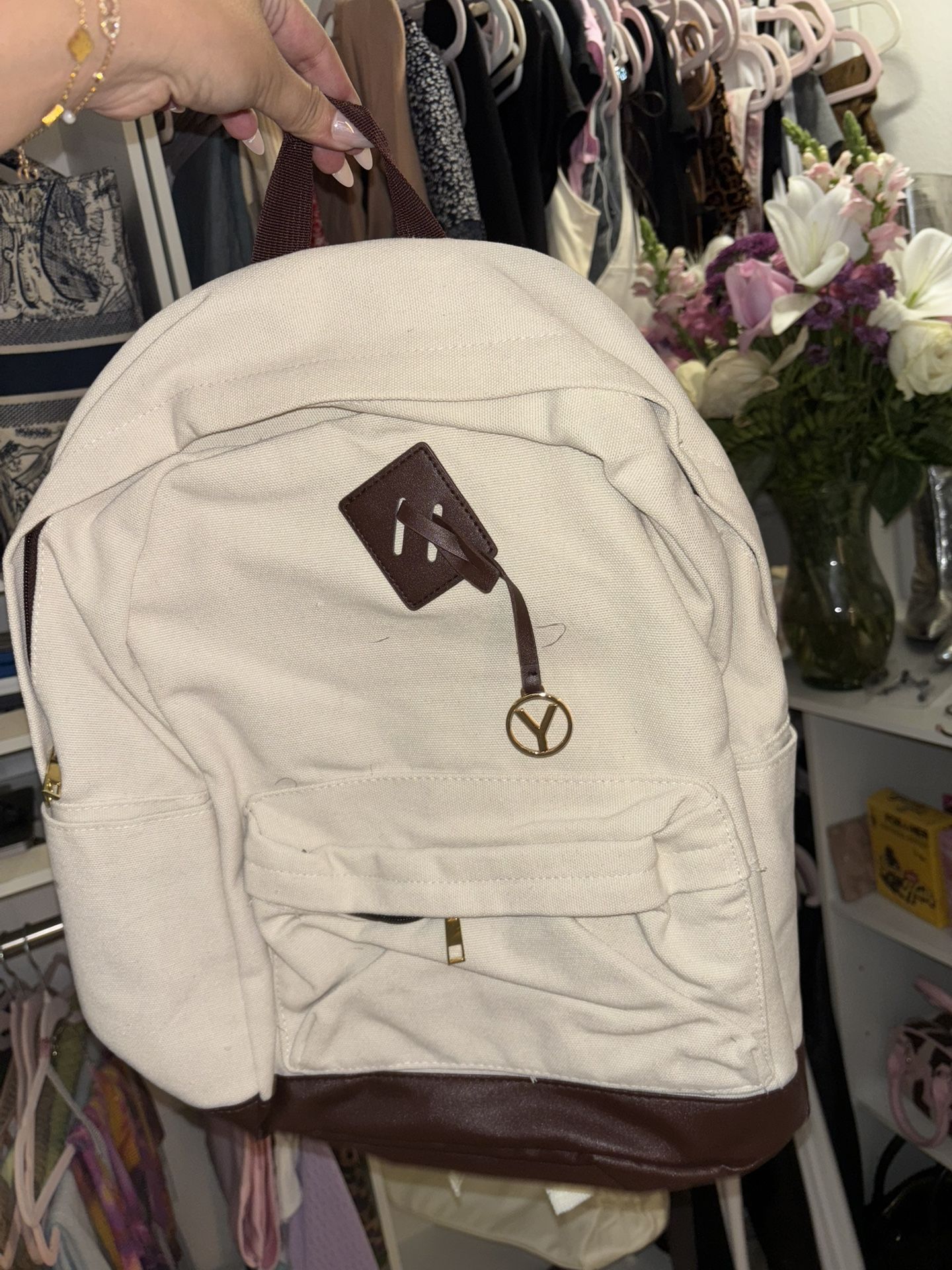 White backpack with leather detail