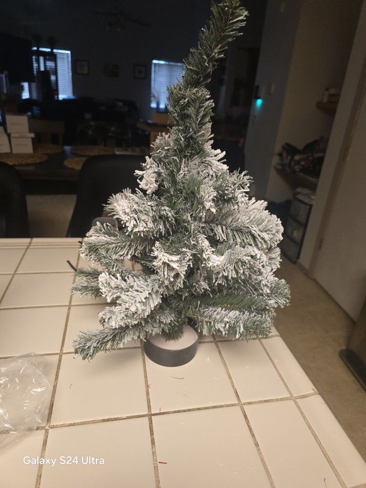 Tabletop christmas tree requires two double a batteries