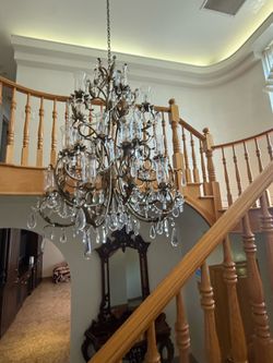 **Elegant Crystal Chandelier**  Beautiful crystal chandelier with a timeless design that adds elegance and sparkle to any dining room or formal living