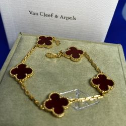 Rose gold bracelet with five red chalcedony clovers