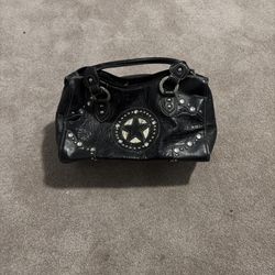 Black hand bag with a star