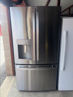 GE Stainless Steel Refrigerator And Freezer