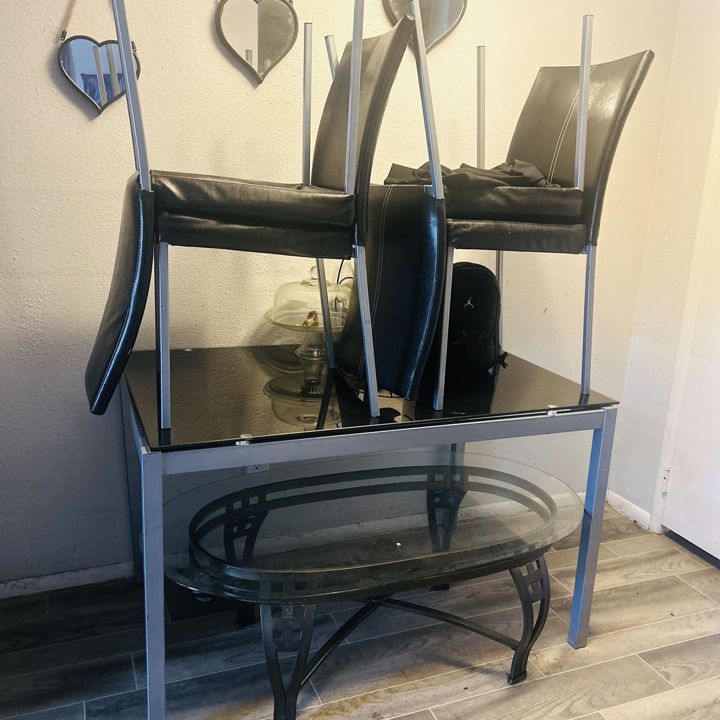 Black Tv entertainment shelf & Glass table w/4 leather chairs 