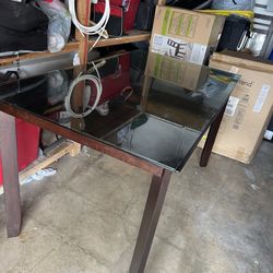 Table And Three Chairs