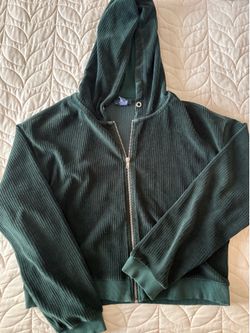 green zip up hoodie