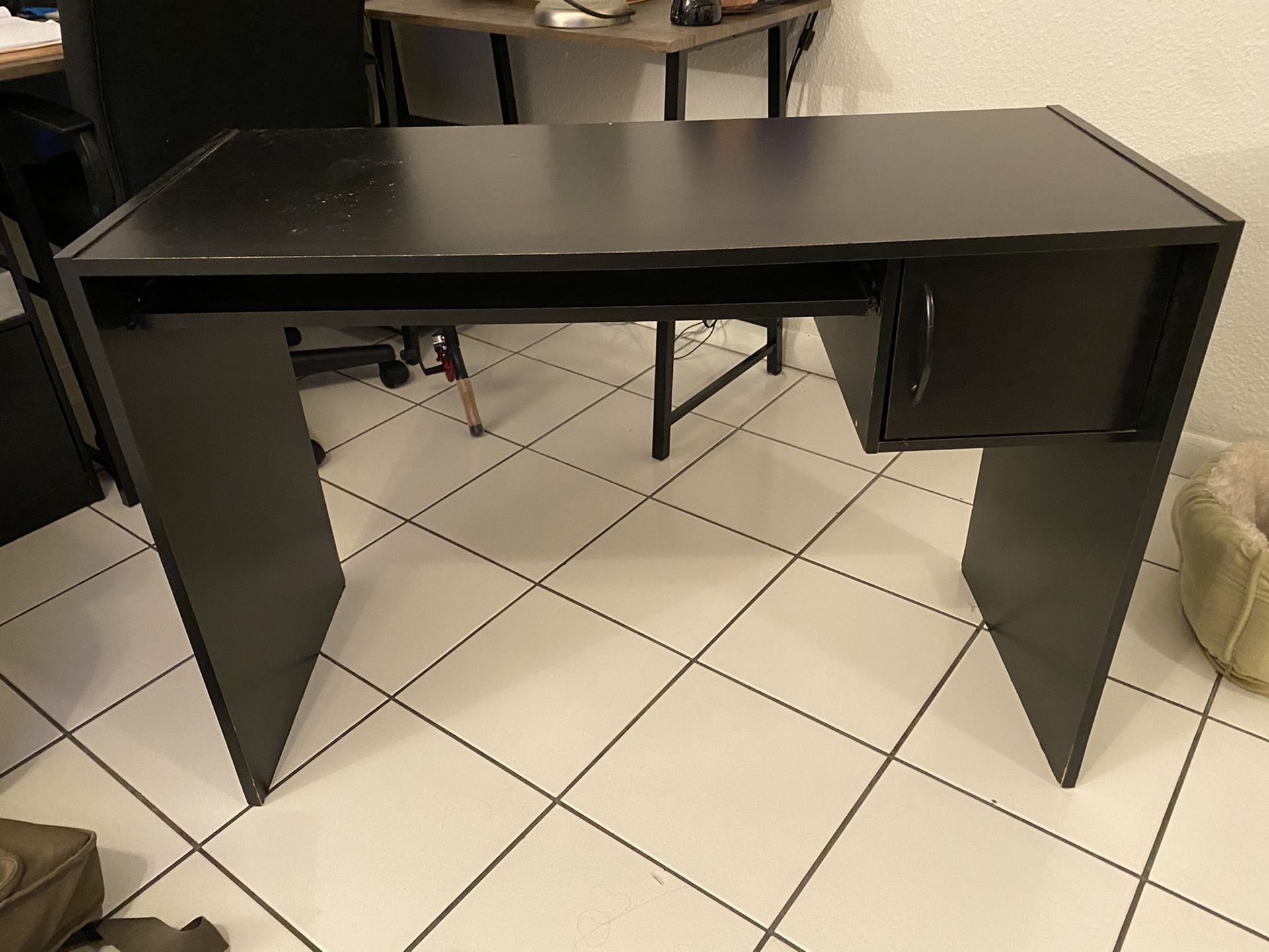 Desk - black, two piece. Includes side piece (with shelves, drawer)