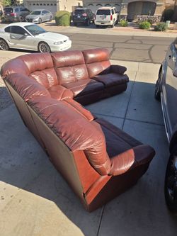 Brown Leather Sectional with two recliners one on each end