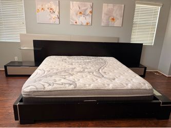 Modern king size bed with nightstands and mattress