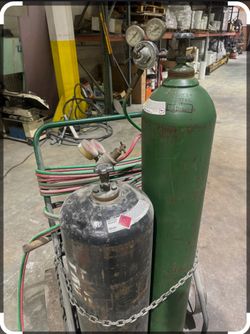 Oxygen And Acetylene Cutting Torch And Tanks
