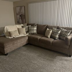 BROWN UPHOLSTERED COUCH