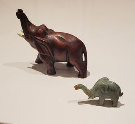 1 wooden elephant, 1 jade elephant