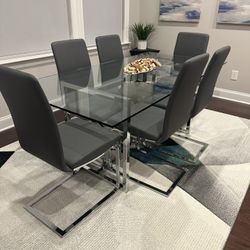 Modern Glass Dining Set – Table, 6 Chairs & Designer Rug - $700