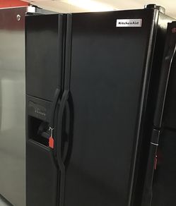 Used Kitchen Aide side by side fridge. 25 cu ft. 1 year warranty