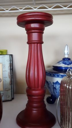 One burgundy tall candle holder