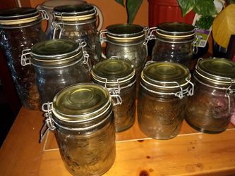 A set of mason jars go from really big to small the fruit prints