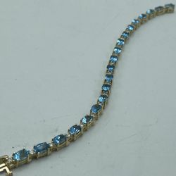 14 KT Yellow Gold 1.00C TW Diamond And Topaz Bracelet 7”