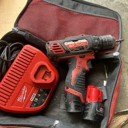 Milwaukee Drill Driver With Charger and Two Batteries In Good Condition 