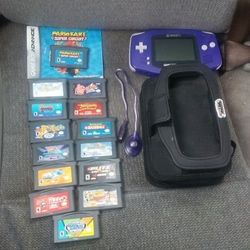 Game Boy Advance W/ 14 games, carrying case , and light cable.