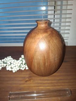 Beautiful hearth and Home Magnolia wood bud vase. With glass insert
