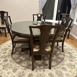 Large round dining table with 6 chairs