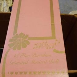 Fine Porcelain animated Musical Doll. Brand new In Original packaging