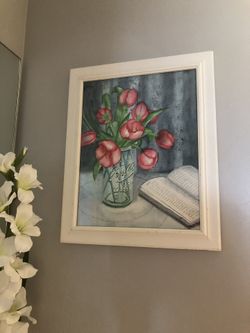 a flower in a vase and a picture, for all $ 15