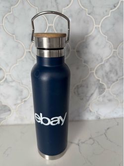 eBay-branded navy blue insulated stainless steel water bottle with a metal handle and bamboo-topped lid