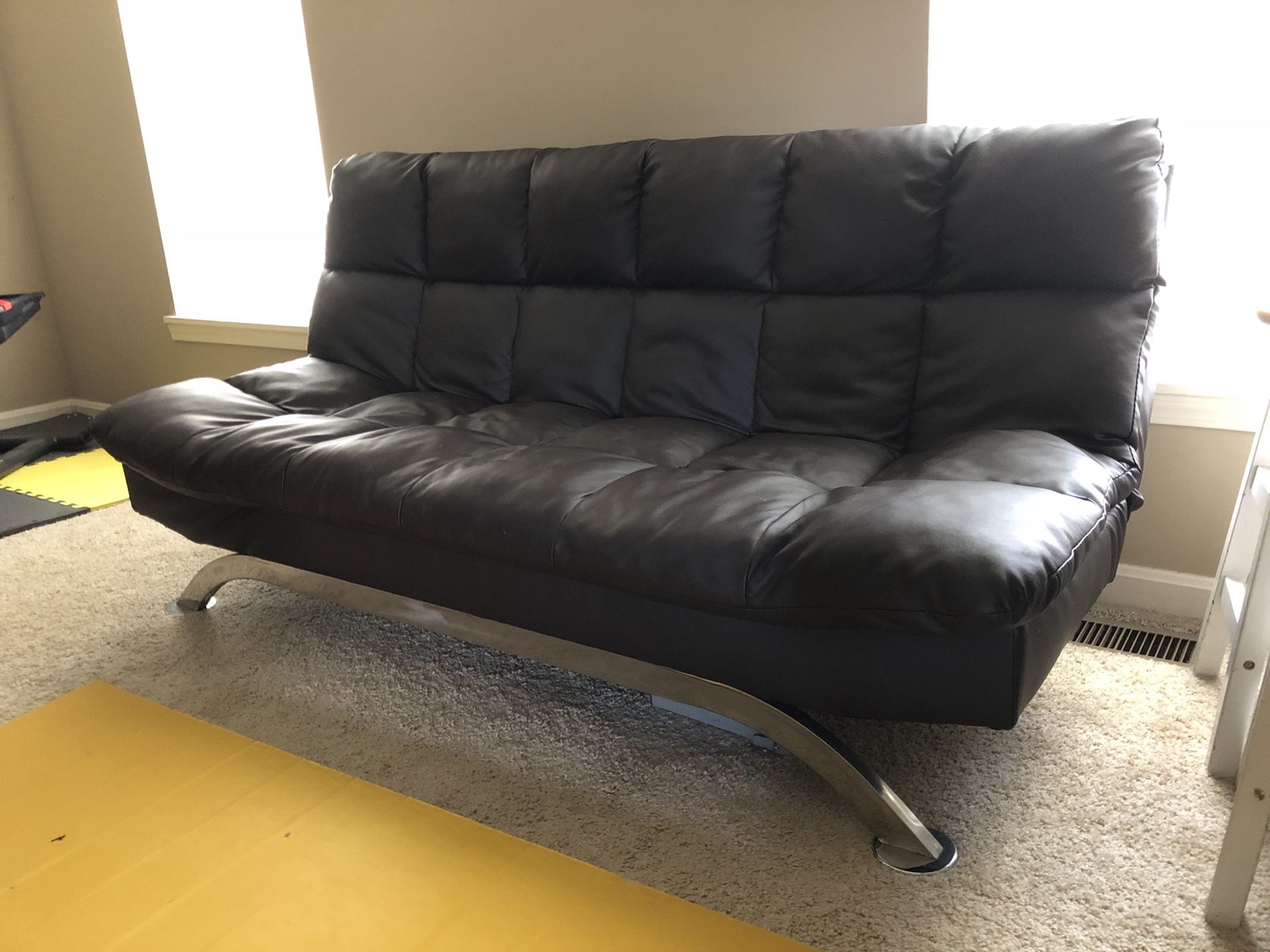 Leather vinyl brown futon couch and 2 chairs.