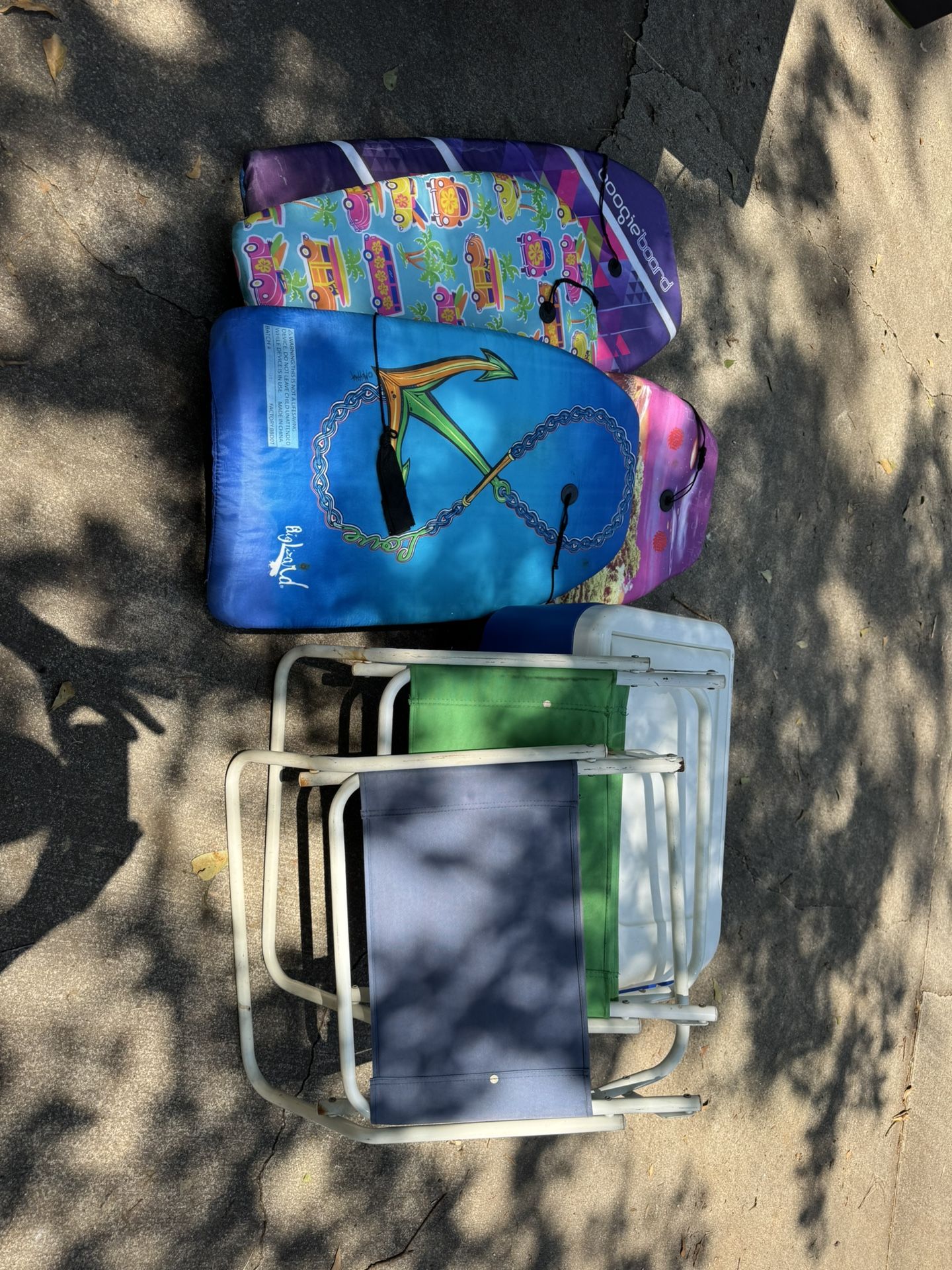 2 Beach Chairs, 4 Boogie Boards, And A Cooler