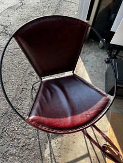 Cast iron/ leather chair  )used) $50obo