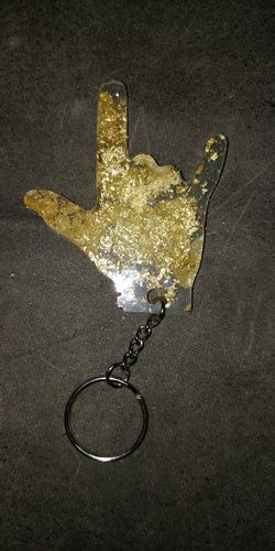 I love you sign keychain or FU keychains.