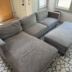 Grey Couch Sectional Sofa And Ottoman (Living Spaces Cosmo)