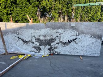 Polished quartzite cristallo book matched, translucent on white veins 130"x 75" $2,500