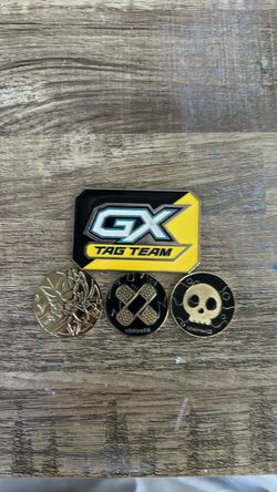 4 metal Pokemon coins: Healer / Poison, gold metal Zamazenta coin from the Sword & Shield Ultra, and GX Tag Team Metal Token