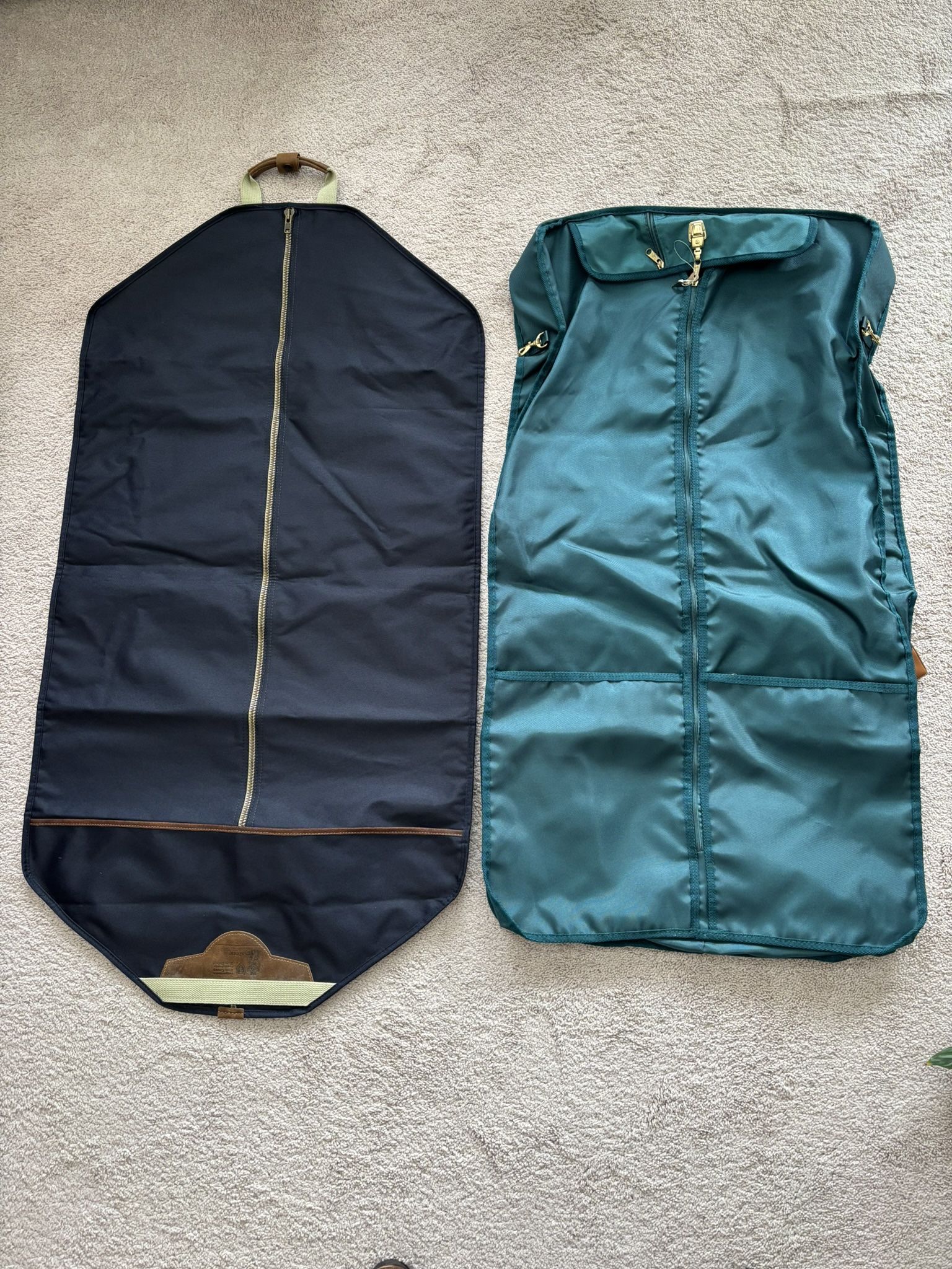 Garment Travel Bags, lot of 2, 4’x2’, excellent condition. 1 premium Ricardo Beverly Hills foldable, hanging, hd vinyl, lockable, 4 extra zippered co