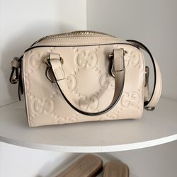 Gucci GG Super Mini Top Handle Bag (also known as the Gucci GG Super Mini 2-Way Handbag