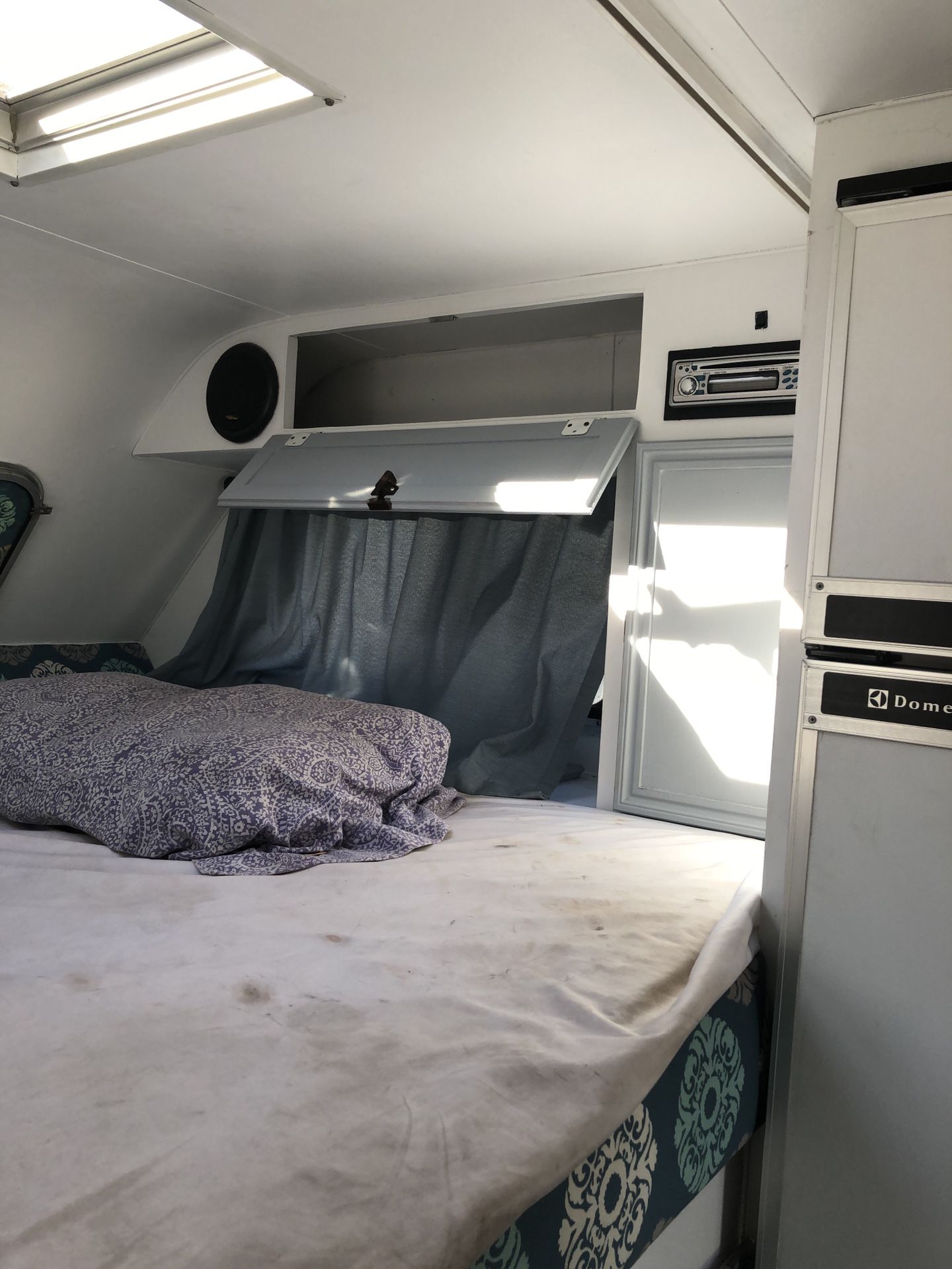 Inside of camper Showing air-conditioning controls and control panel on the left