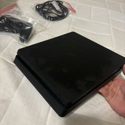 PlayStation 4 Slim with controller 