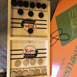 New in box wooden simplenice fast sling puck game
