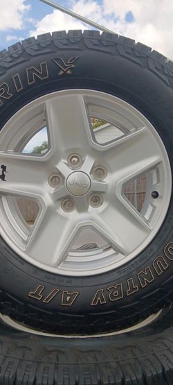 Jeep willy rims with. Tires like brand new out the box,  265 70 17,