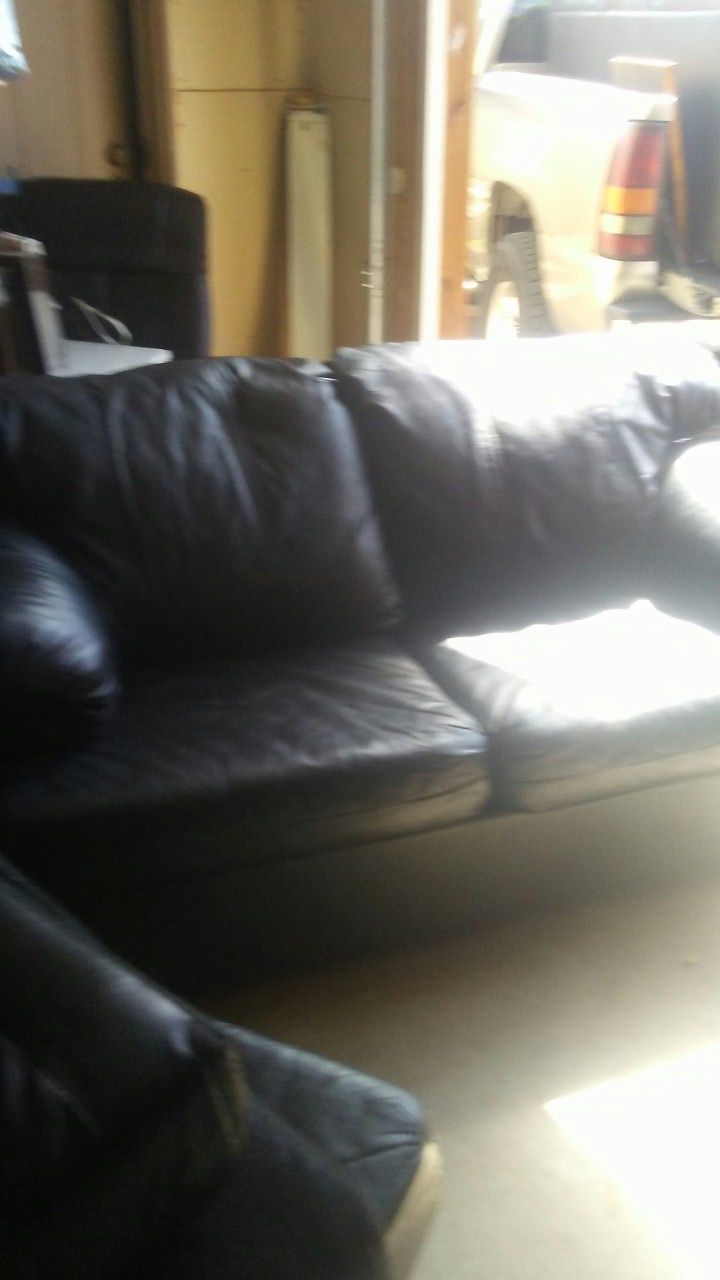Black leather sofa and love seat like new condition