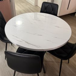White Table And 4 Black Chairs 